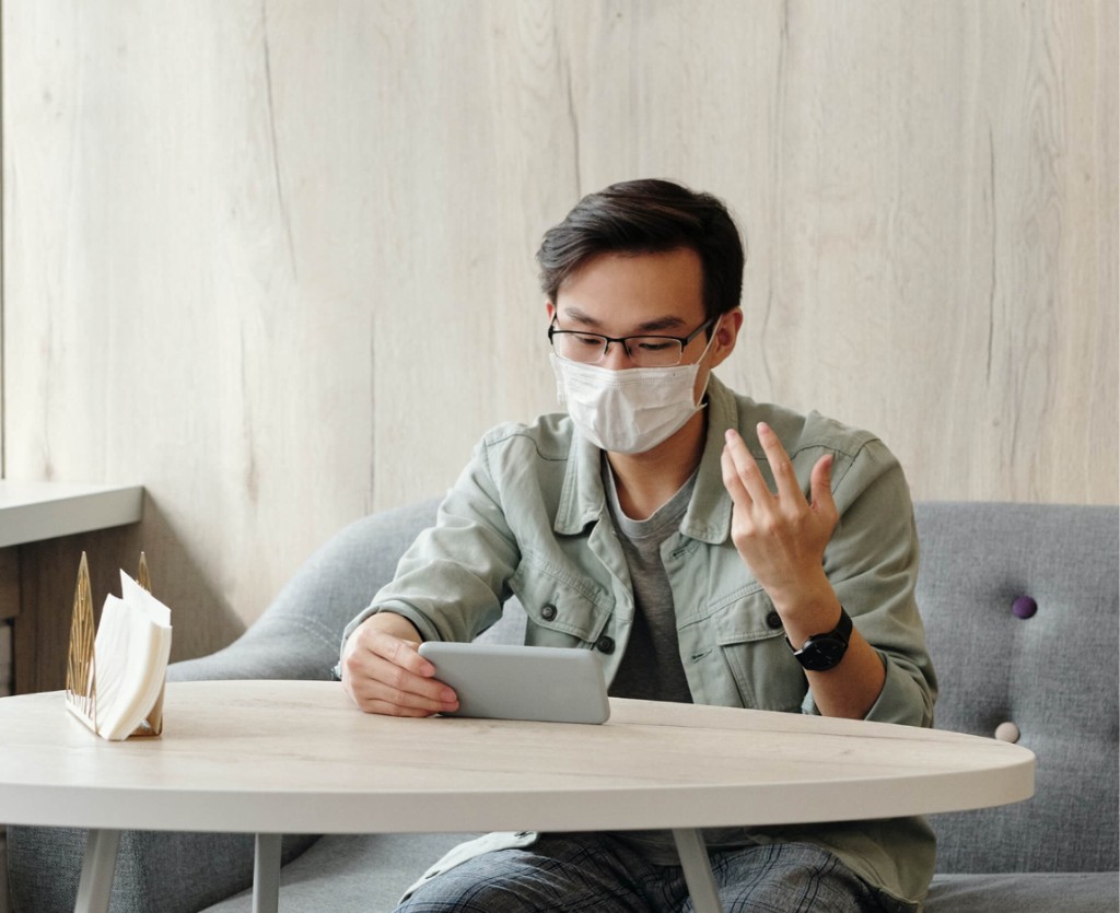 A patient attending a secure video consultation from home
