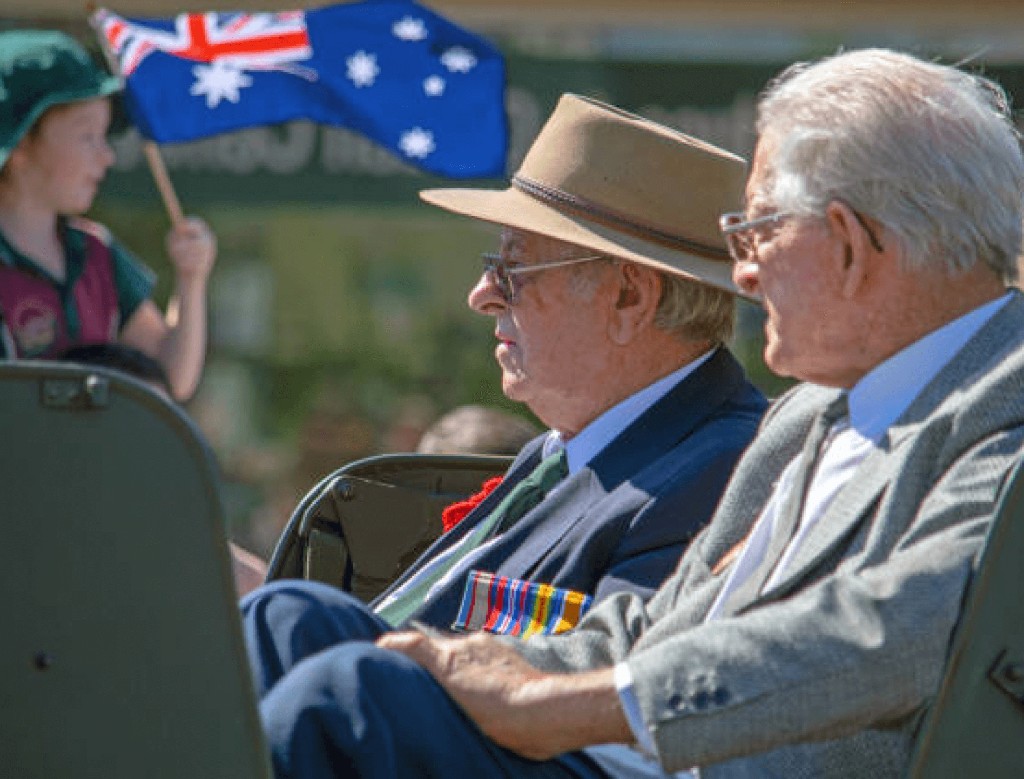 Australian veterans wearing service medals at a commemorative parade
