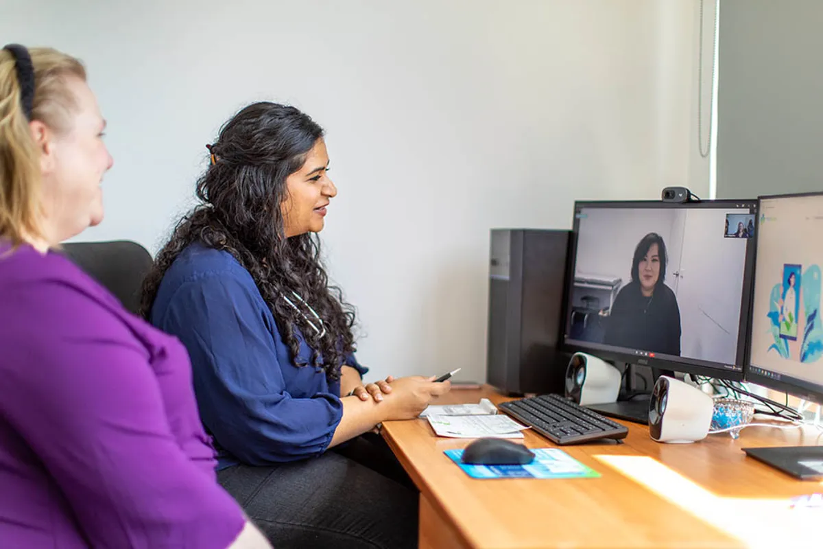 Clinicians on a video call with a patient during a remote consultation